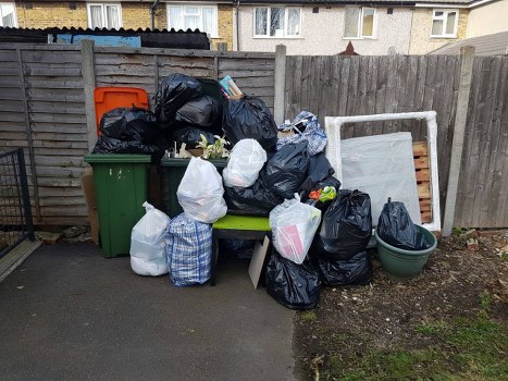 Construction site with waste being cleared in Swiss Cottage
