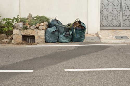 Professionals performing garage clearance in Swiss Cottage
