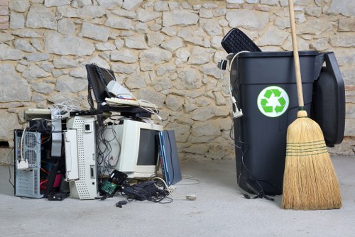 Workers managing construction waste through recycling
